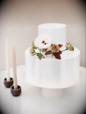 simple fall wedding cake with fondant icing and blush and mauve flowers