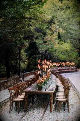 Rustic wooden serpentine table on train tracks