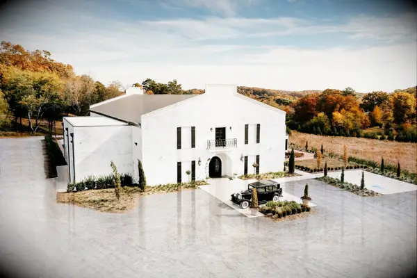 Charming white Italian-inspired venue surrounded by fields