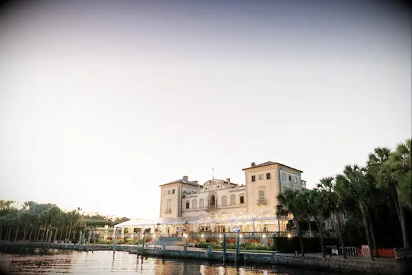 Overview of grand wedding venue and pond