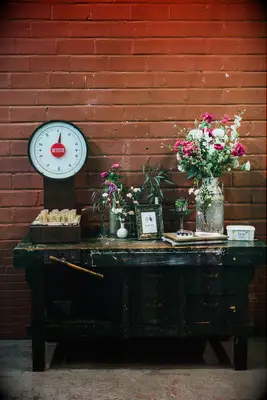 repurposed wooden work bench as unique wedding gift table and guest book display