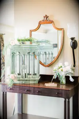 wedding gift table with mint green antique bird cage as unique card box idea