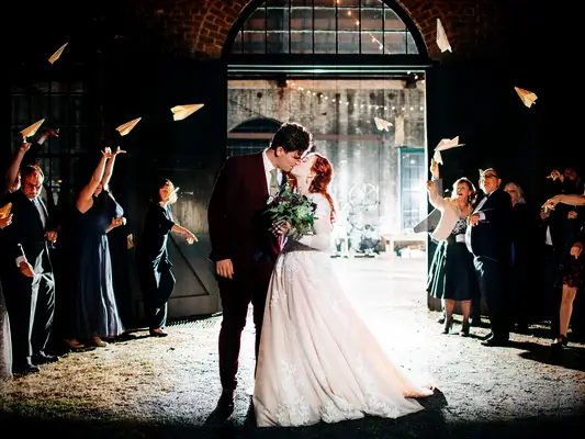 Paper airplane wedding exit