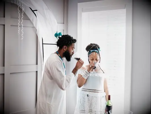 couple participating in wedding libation ceremony