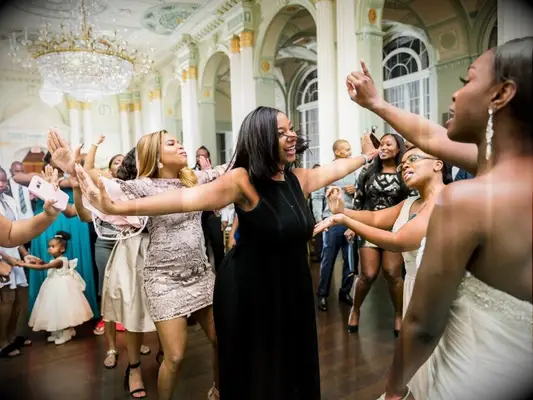sorority sisters dancing during wedding reception