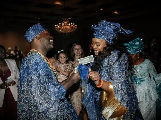 bride and groom participating in money dance