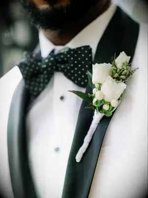 White boutonniere on black-and-white tux jacket