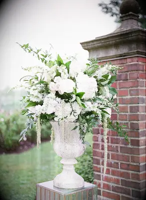 Romantic white floral arrangement in urn