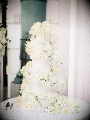 Cake with cascade of white fresh flowers