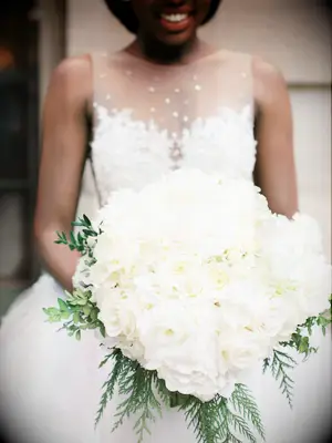 bride holding white bouquet