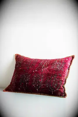 Gorgeous red velvet pillow from Anthropologie for your Beauty and the Beast wedding