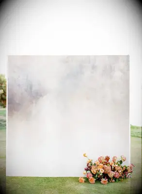 Minimal gray backdrop with floral accent