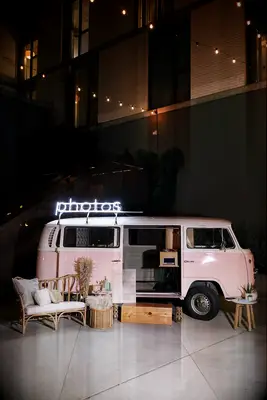 Pink VW bus photo booth with boho decorations