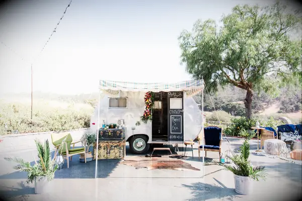 Camper photo booth at desert wedding