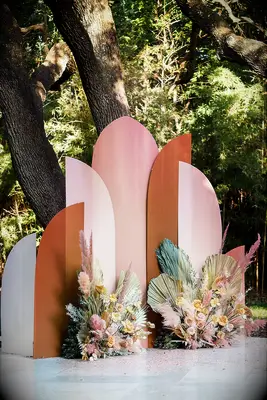 Modern clay-colored backdrop with floral accents