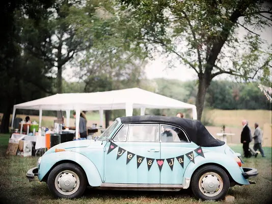 Vintage pale blue VW Bug wedding getaway car