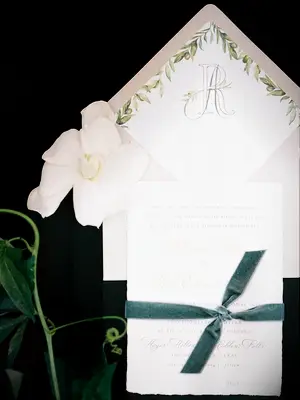 Invitation flat lay styled with gardenia bloom