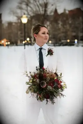 To-be-wed holding protea bouquet