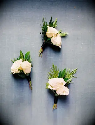 Three white boutonnieres