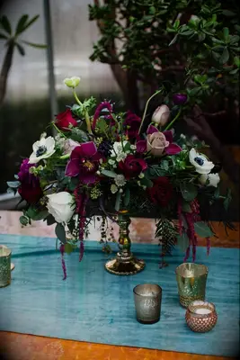 Centerpiece with amaranths, orchids and anemone blooms