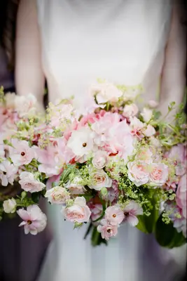 light pink wedding bouquet with cosmos, spray roses and greenery