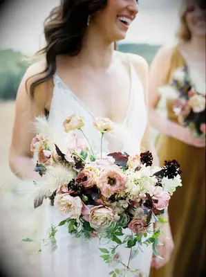 fall wedding bouquet with mauve garden roses, burgundy scabiosa and dried grasses