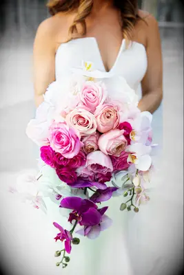 cascading wedding bouquet with pink ombre roses and purple phalaenopsis orchids