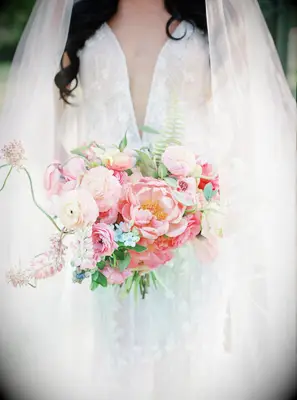 whimsical pink wedding bouquet with peonies, ranunculus, blue forget-me-nots and ferns