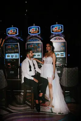 Couple beside the slot machines 