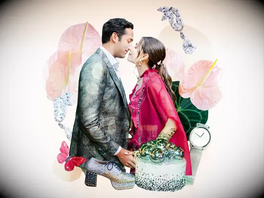 Couple kissing surrounded by colorful glam wedding theme decor