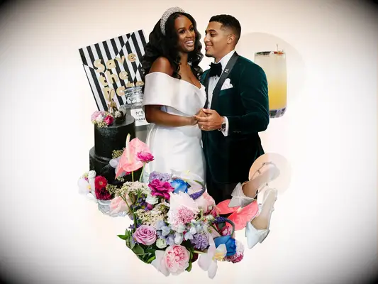 Couple holding hands surrounded by modern wedding theme decor