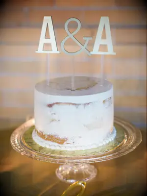simple one tier wedding cake with A & A cake topper 