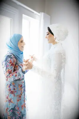 Bride wearing veil with hair covering
