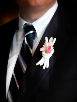 White knotted boutonnière as a tie the knot idea.