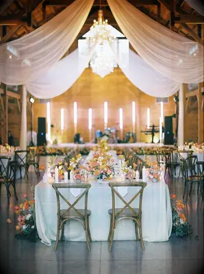 Elegant barn reception space with florals