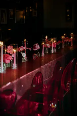 Red table and chairs and pink candles
