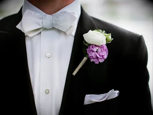 purple camellia boutonniere
