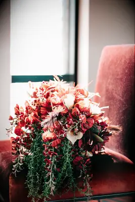 Red orchid cascading bouquet