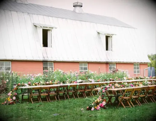 Unique outdoor ceremony space with floral decor and tables at Hope Flower Farm in Waterford, Virginia