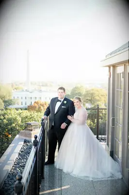 Couple pictured on the balcony of the Hay-Adams Hotel in Washington, DC