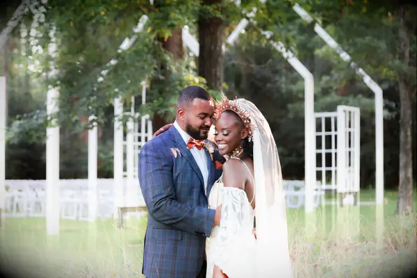 Couple in front of outside ceremony space at The Meekermark in Magnolia, Texas