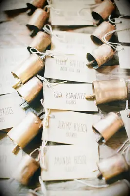 Rustic cow bell escort cards. 