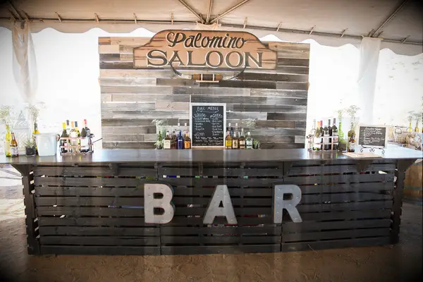 Rustic outdoor bar made of wood panels. 