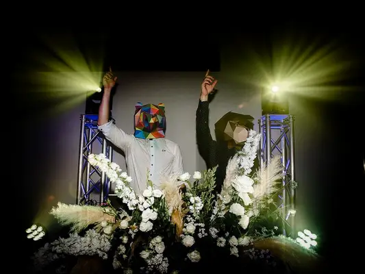 DJs wearing face masks at rave-inspired wedding reception