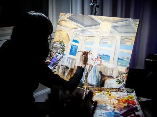 Live wedding painter at wedding reception