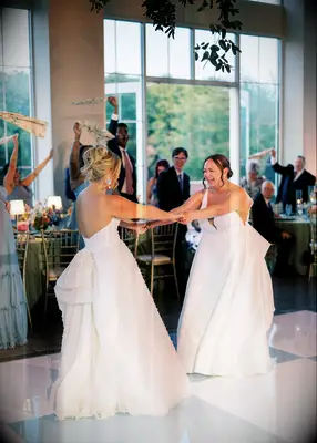 Two brides dancing at wedding