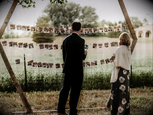 Interactive photo display at a backyard wedding