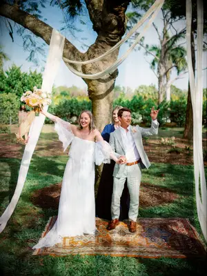 Fabric wedding arch at backyard wedding