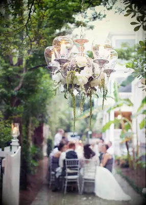 Floral chandelier at backyard wedding