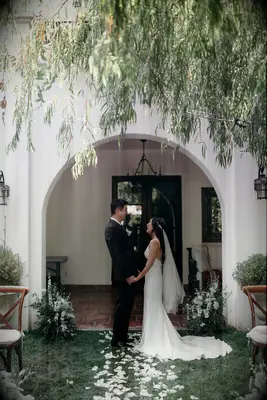 Rose petal aisle runner at backyard wedding